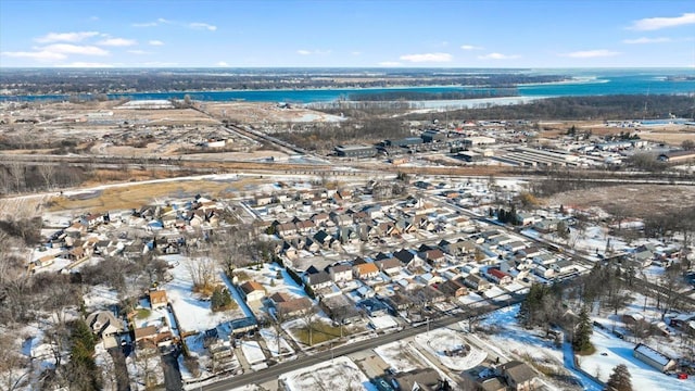 drone / aerial view featuring a water view and a residential view