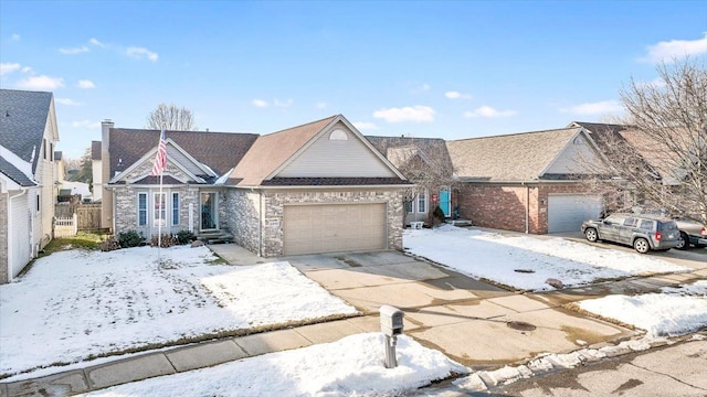 view of front of home featuring driveway, an attached garage, and brick siding