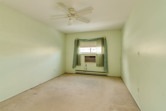 empty room with light carpet, a ceiling fan, a baseboard heating unit, and cooling unit