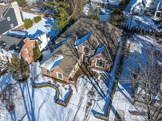 snowy aerial view featuring a residential view