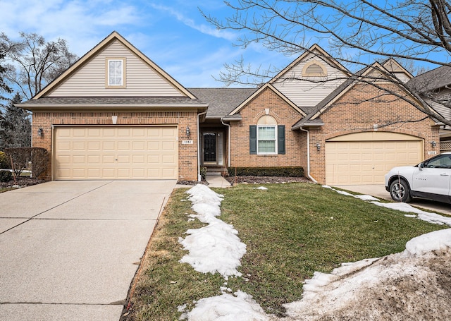 view of front of property with an attached garage, a shingled roof, concrete driveway, and brick siding