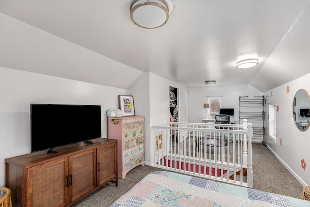 bedroom with carpet, lofted ceiling, and baseboards