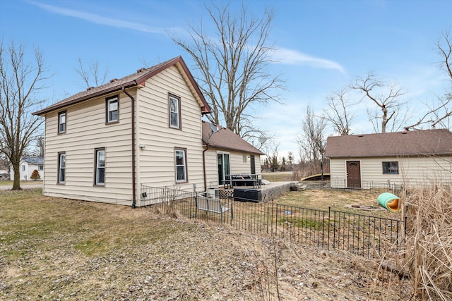 view of side of property featuring a yard and fence