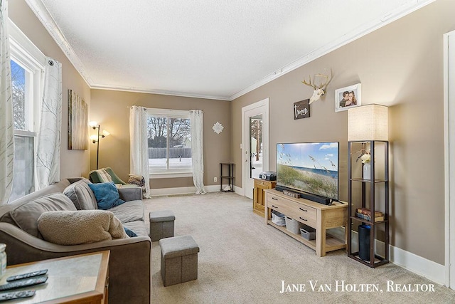 living room with crown molding, baseboards, and light colored carpet