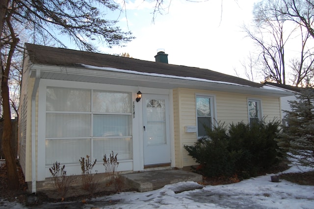 view of front of home with a chimney