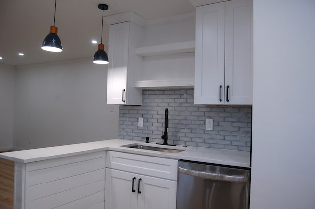 kitchen with a sink, white cabinets, light countertops, stainless steel dishwasher, and open shelves