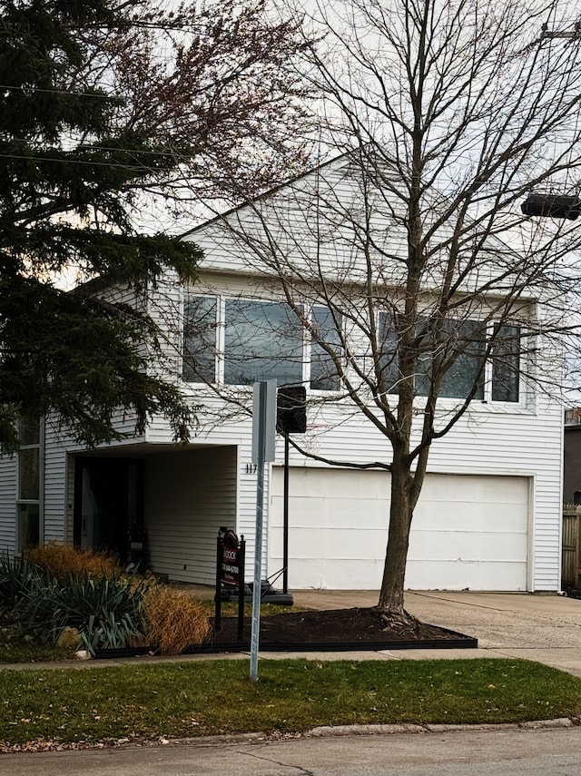 view of front of property with a garage and driveway