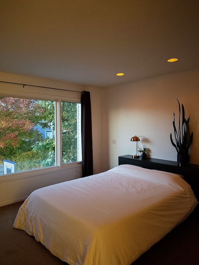 carpeted bedroom with recessed lighting