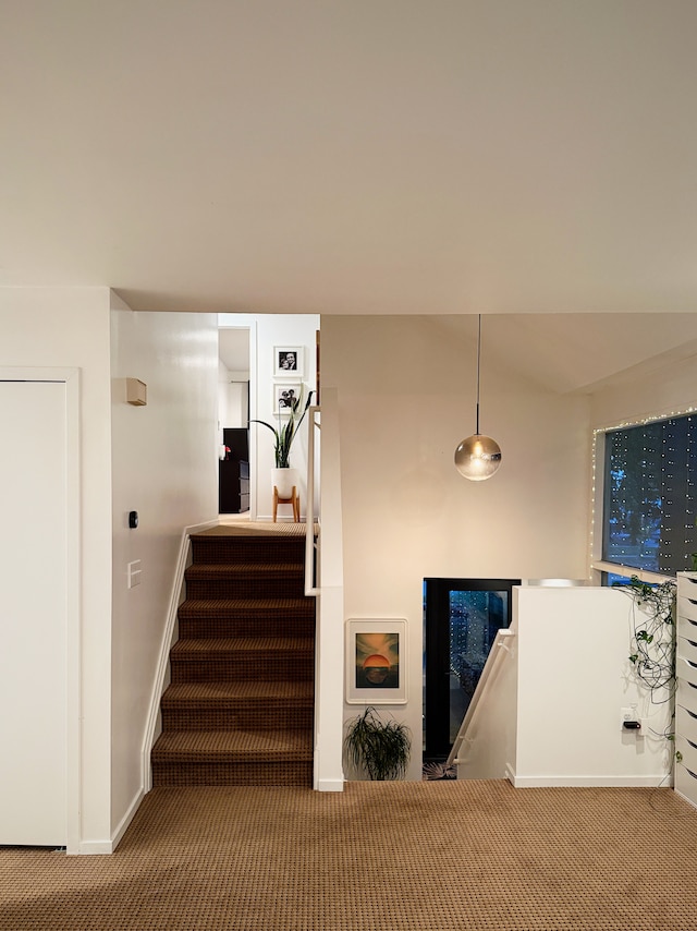 staircase with carpet and baseboards