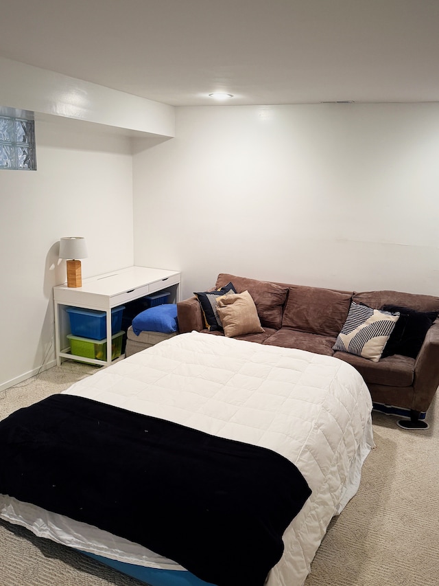 bedroom with carpet and baseboards