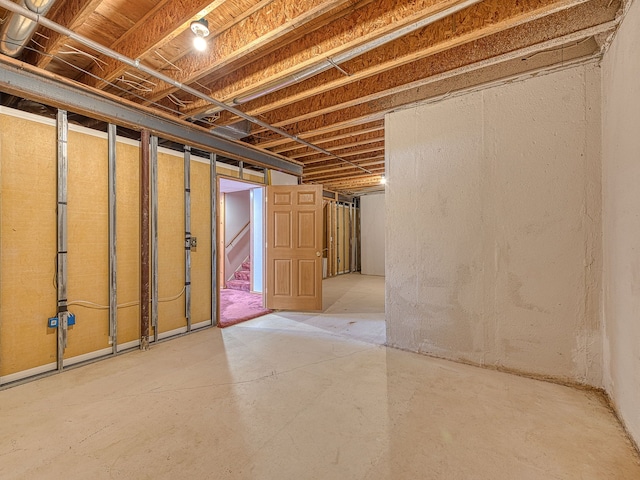 unfinished basement with stairway