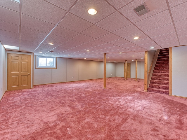 basement featuring carpet floors, recessed lighting, visible vents, a drop ceiling, and stairs