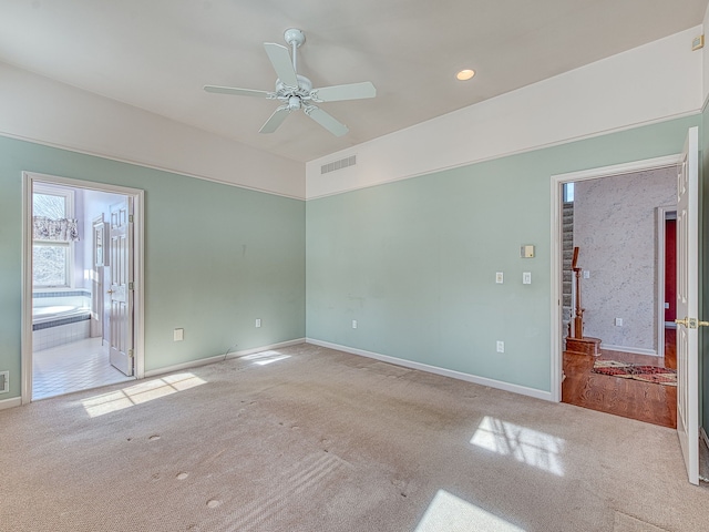 unfurnished room featuring recessed lighting, light colored carpet, visible vents, ceiling fan, and baseboards