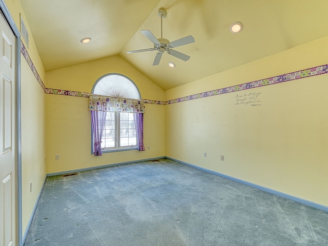 spare room featuring recessed lighting, carpet flooring, a ceiling fan, baseboards, and vaulted ceiling