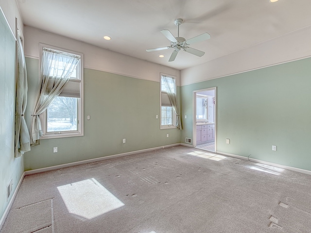 unfurnished room with recessed lighting, visible vents, light carpet, ceiling fan, and baseboards