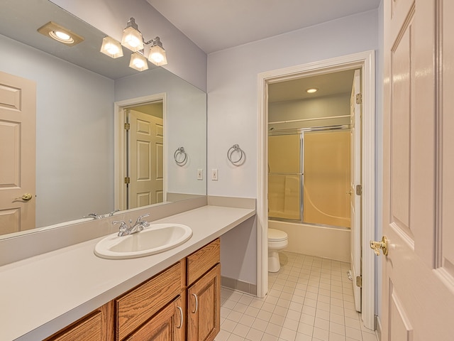 full bath with toilet, shower / bath combination with glass door, tile patterned flooring, and vanity