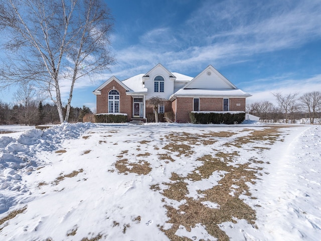 view of front of house featuring brick siding