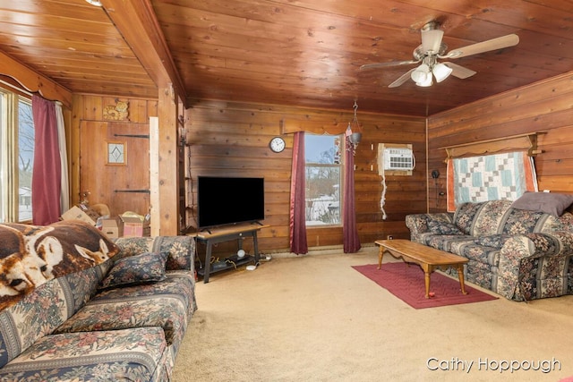 carpeted living area featuring wood walls, wood ceiling, a ceiling fan, a wall mounted AC, and beam ceiling