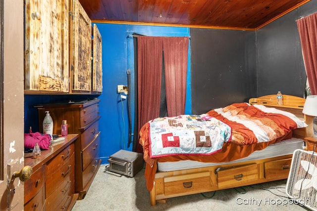 bedroom featuring wood ceiling and carpet flooring