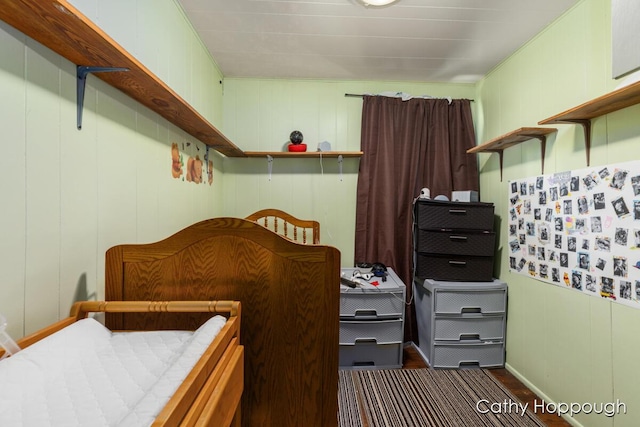 bedroom with dark wood-style floors