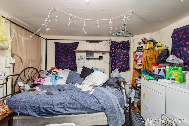 bedroom with washing machine and dryer