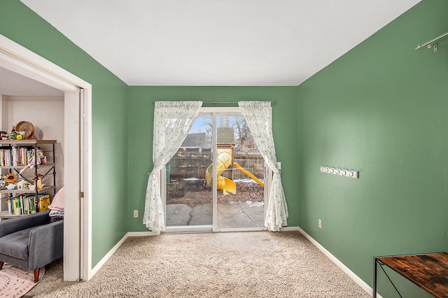 dining room with carpet floors and baseboards