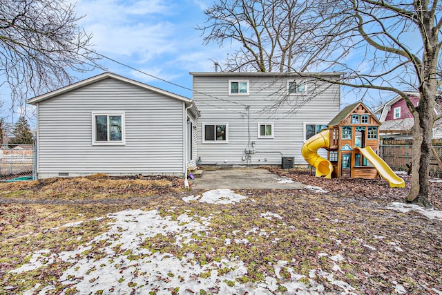 back of house with a playground, a patio, central air condition unit, crawl space, and fence