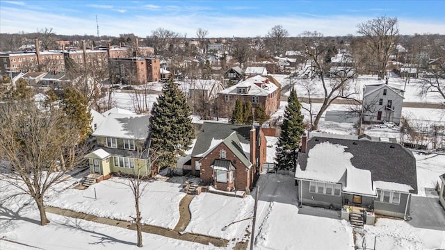 snowy aerial view featuring a residential view