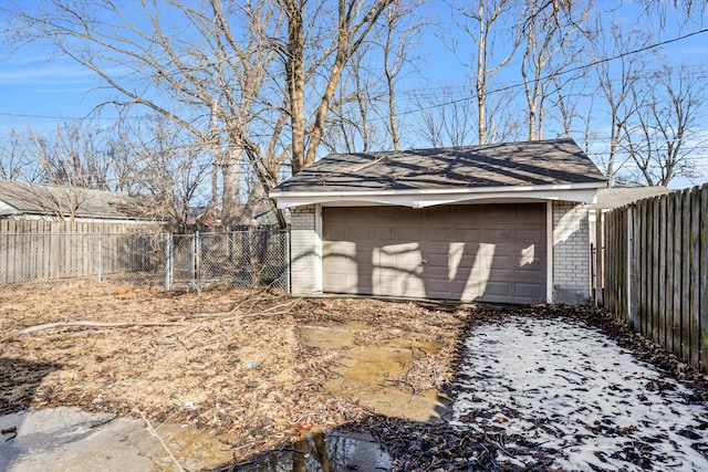 exterior space featuring an outbuilding and fence