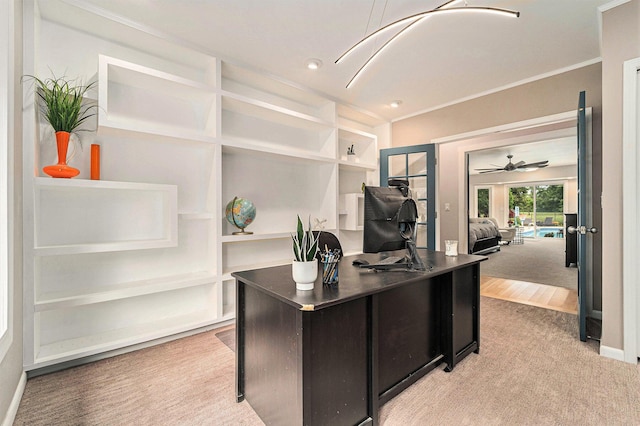 office with light carpet, baseboards, and crown molding