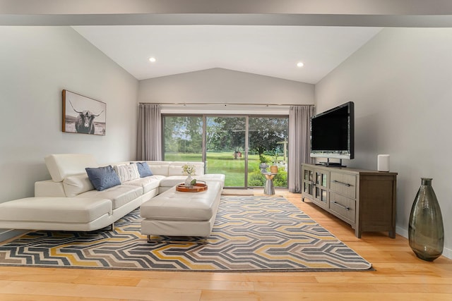 living room featuring lofted ceiling, baseboards, light wood finished floors, and recessed lighting