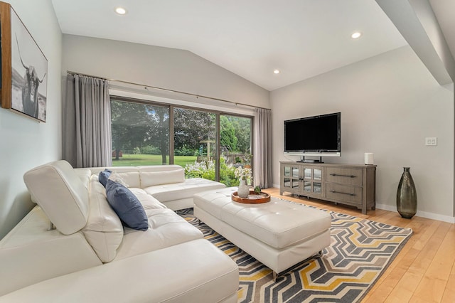 living room with light wood-style floors, lofted ceiling, baseboards, and recessed lighting