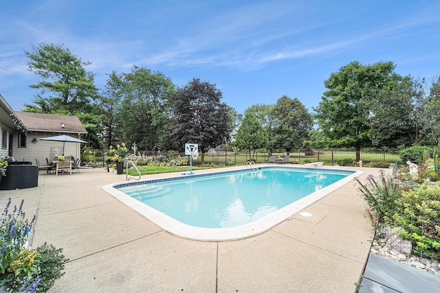 view of pool featuring a fenced in pool, fence, and a patio