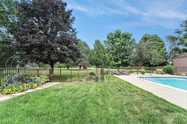 view of yard with a gazebo, a patio area, a fenced backyard, and a fenced in pool