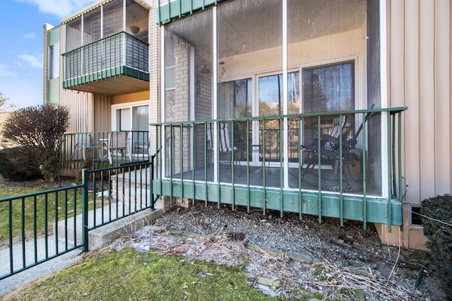 view of home's exterior with a balcony