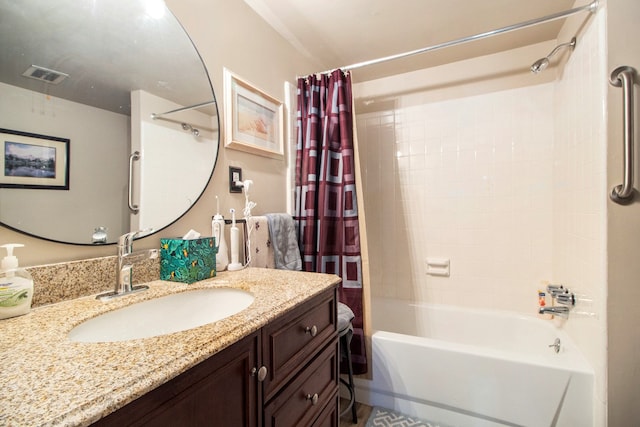 bathroom featuring shower / tub combo, visible vents, and vanity