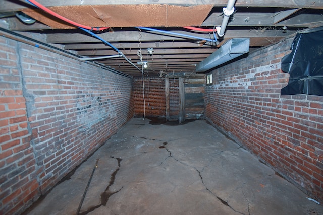 unfinished basement with brick wall