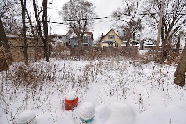 view of yard layered in snow