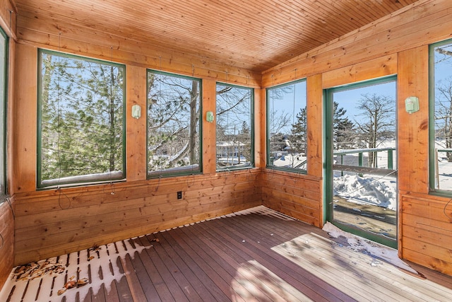 unfurnished sunroom with wood ceiling