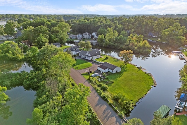 bird's eye view featuring a forest view, a water view, and a residential view