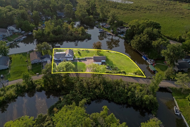 drone / aerial view featuring a residential view and a water view