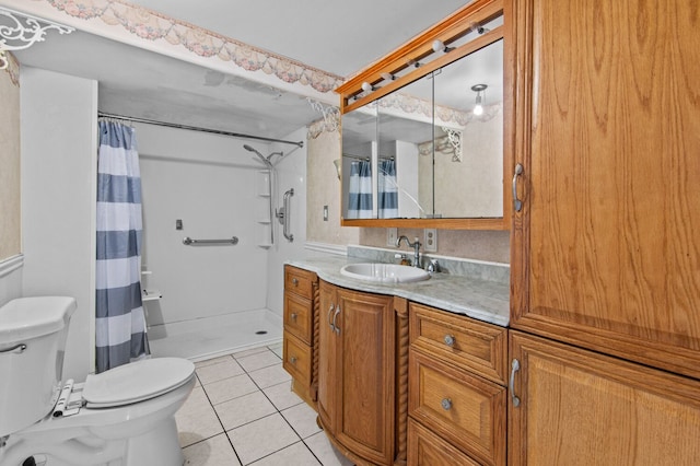 bathroom with a stall shower, tile patterned flooring, vanity, and toilet