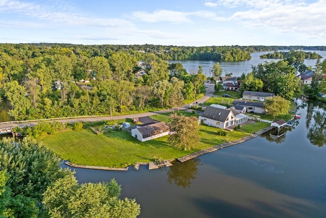 bird's eye view featuring a water view and a view of trees