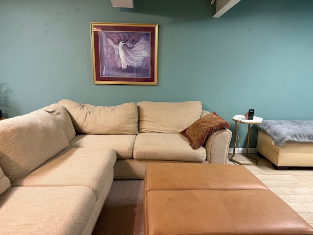 living room with baseboards and wood finished floors