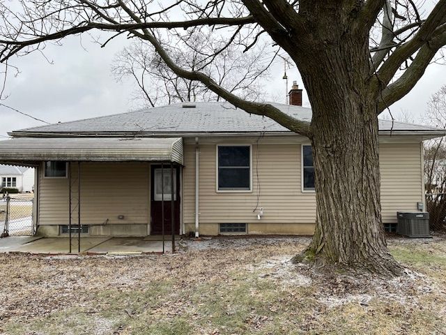 back of house with central AC, a patio, a chimney, and fence