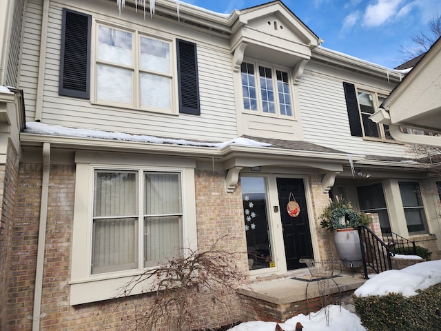 view of front of home with brick siding