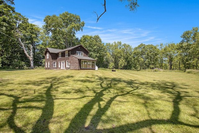 view of yard featuring a sunroom