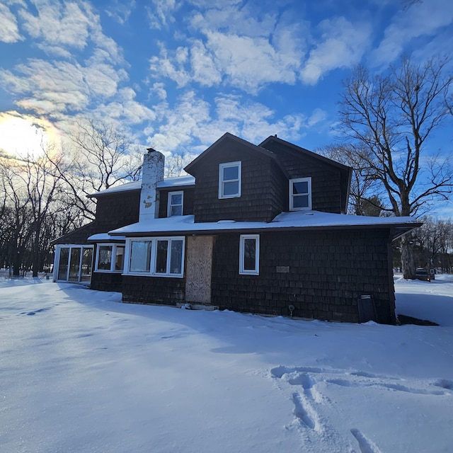 view of front of property featuring a chimney