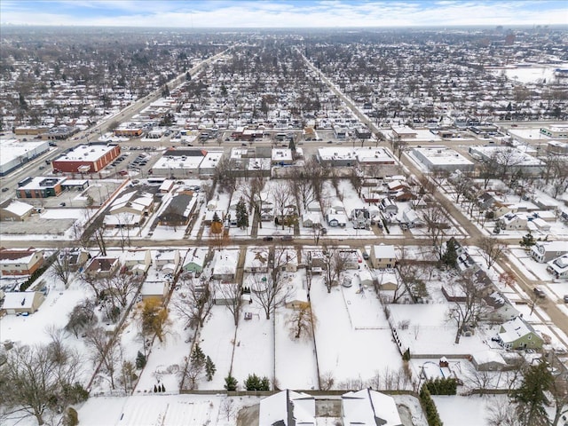 snowy aerial view with a residential view