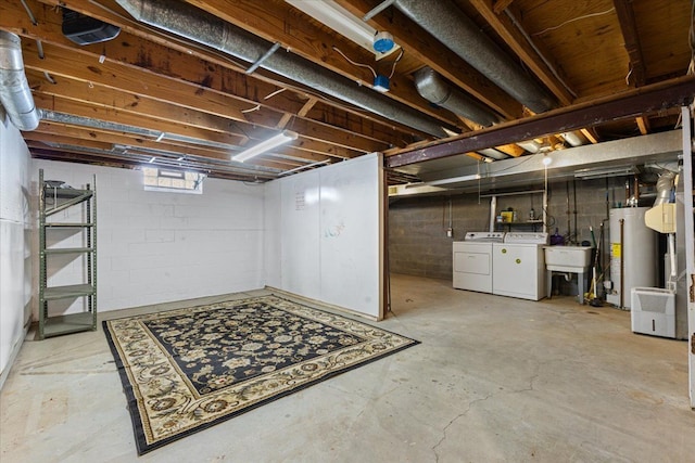 below grade area with gas water heater, independent washer and dryer, and a sink